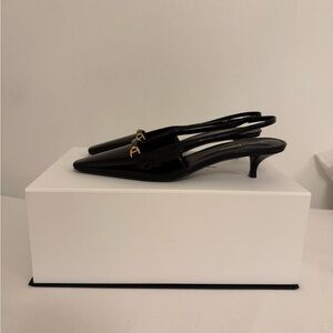 Saint Laurent Black and Gold Slingback Heels